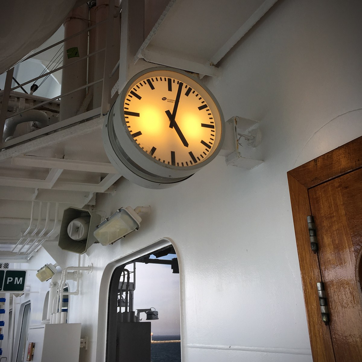 A ship’s clock on deck, aboard a Princess ship