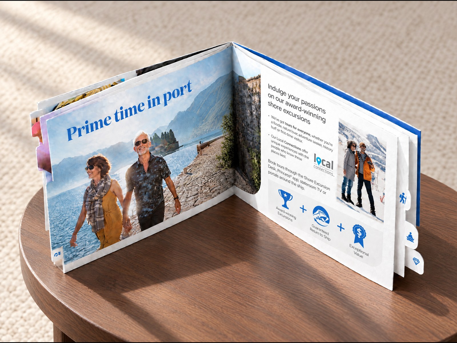 The Sun Princess Day 1 Welcome Guide standing open at its Prime time in port spread on a round walnut side table, with die-cut side index tabs down the page edge