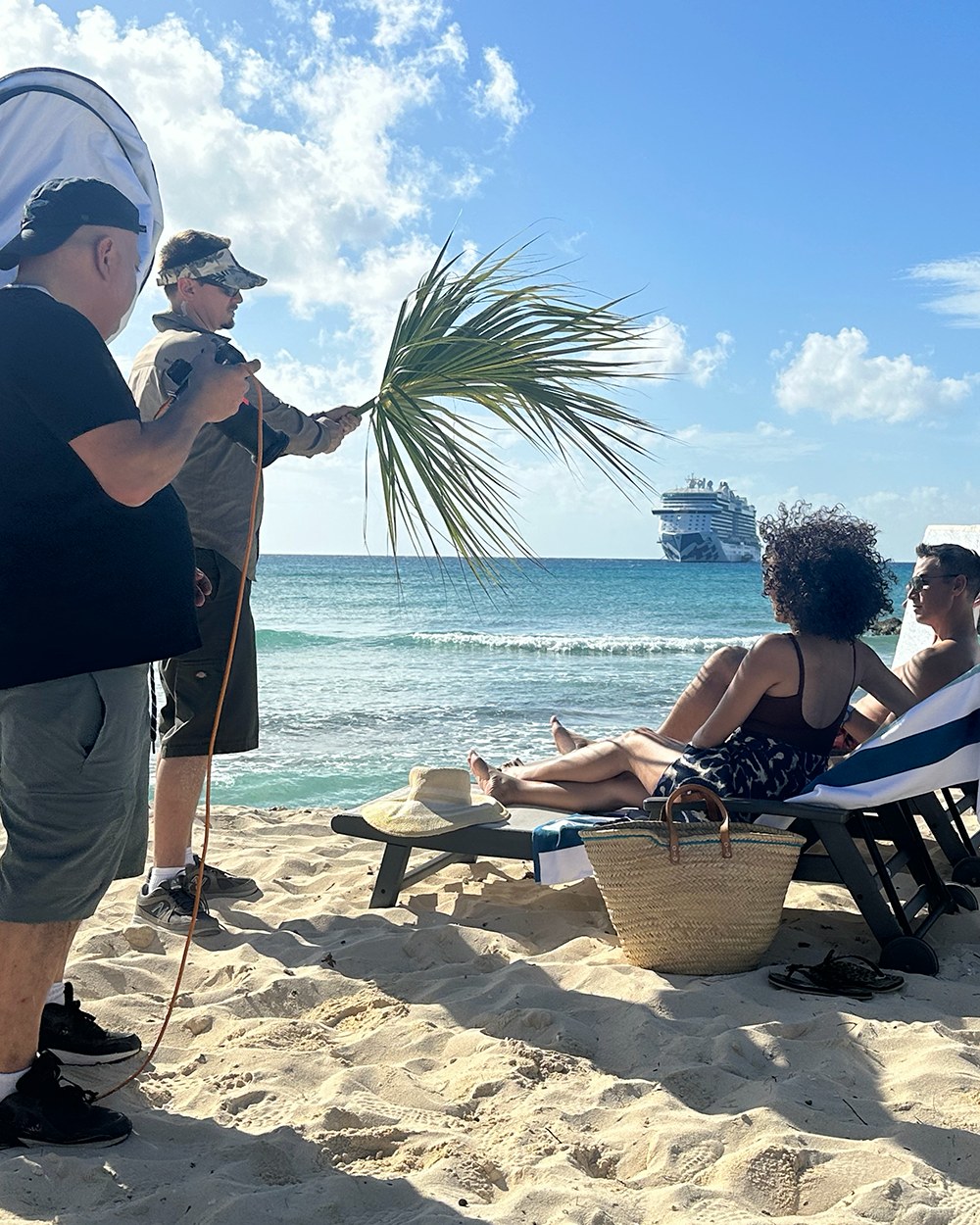 On set: a beach photo shoot with a Princess ship offshore